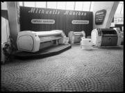 Ripresa interno. Esposizione di impianti lavanderie. A fianco della merce si trova un cartello con la scritta: 